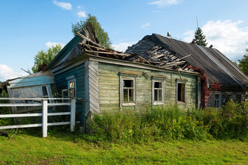 Abandoned and ruined wooden house in the village