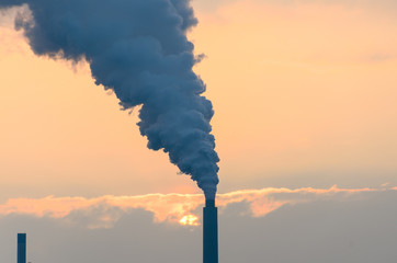 Smoke belching from an industrial smokestack