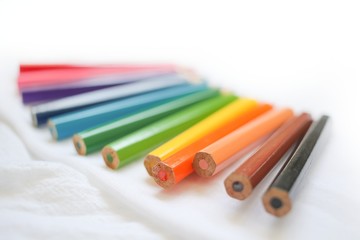 Colorful colored pencils close up, art supplies for painting education in classroom, kids stationary in school on white background, rainbow unicorn color, diversity,happy life, gay pride, lgbt concept
