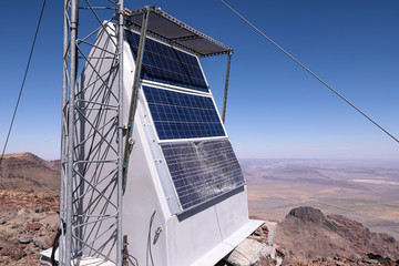 A block of solar panels to supply electrical power to a cellular tower at a remote location. One solar panes intentionally broken