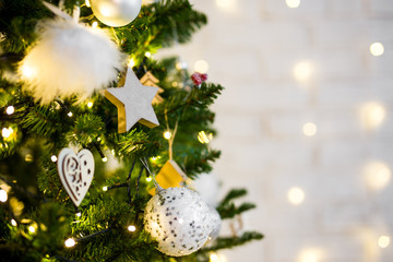 close up of decorated christmas tree with lights and copy space
