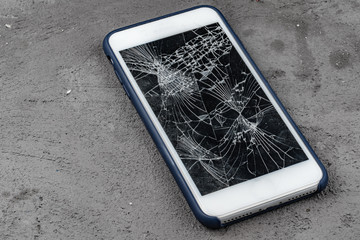 Mobile smartphone with broken screen close up
