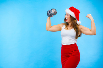 Santa claus woman lifting dumbbells