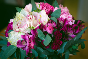 close up beautiful bouquet of  white and red flowers with eucalyptus leaves