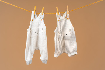 Kid's apparel pinned to a clothesline to dry