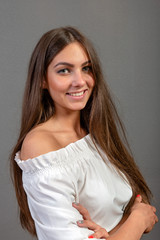 Fototapeta premium Emotional young woman portrait on dark background - image