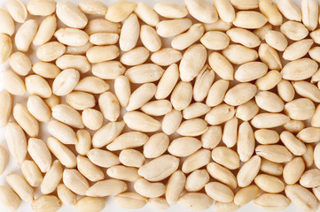 peanuts peeled raw background top view
