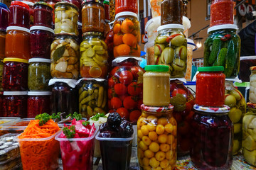 Kiev, UkraineConserved and preserved vegetables in jars at an indoor market.