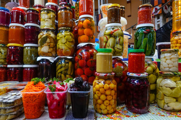 Kiev, UkraineConserved and preserved vegetables in jars at an indoor market.