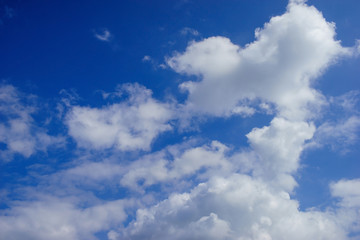 Naklejka na ściany i meble white clouds and blue sky on sunny summer autumn background