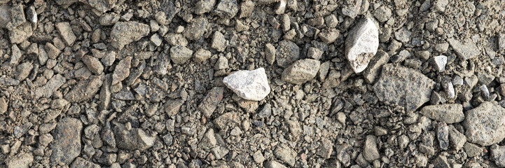 Panoramic image. Gray gravel stones for the underground in road construction