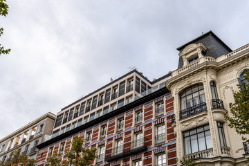 Old luxury residential buildings with balconies in Serrano Street in Salamanca district in Madrid