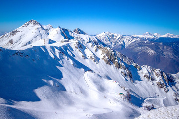 Fototapeta na wymiar Ski Resort Of Russia - Rosa Khutor. Winter Sunny day in the mountains.