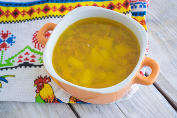 bowl of vegetable soup, rustic style