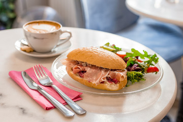 Breakfast and Lunch - Sandwich and Coffee. Cup of coffee with beautiful Latte art, place for text. Food concept.