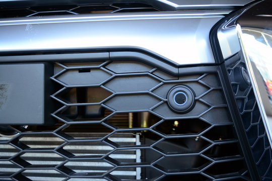 the small sensor on black grills  at the front of the pick up truck car