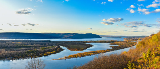 river with islands against the backdrop of mountains and sky, natural landscape