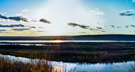 river with islands against the backdrop of mountains and sky, natural landscape