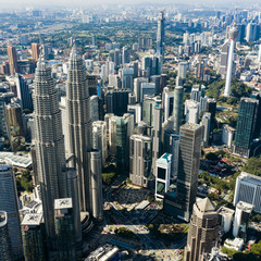 Fototapeta premium Aerial view of the Kuala Lumpur city skyline with the Petronas Twin Towers. Kuala Lumpur commonly known as KL, is the national capital of Malaysia.