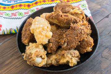 Pan fried chicken wings in breadcrumbs