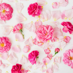 Fototapeta na wymiar Floral composition with pink roses and leaves on white background. Flat lay