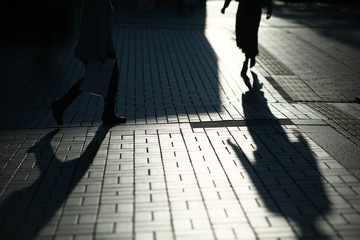 Tokyo,Japan-November 5, 2019: Shadow of pedestrian on tile pavement in Tokyo