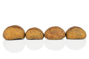 Group of four whole sweet brown chestnut isolated on white background