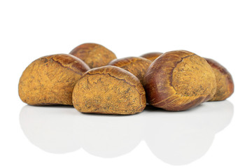 Lot of whole sweet brown chestnut isolated on white background