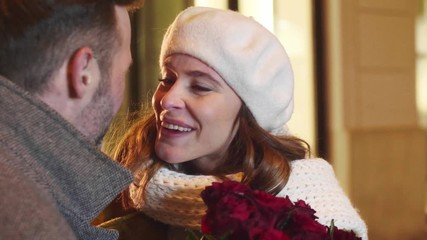 Loving couple with a bunch of roses  flirting