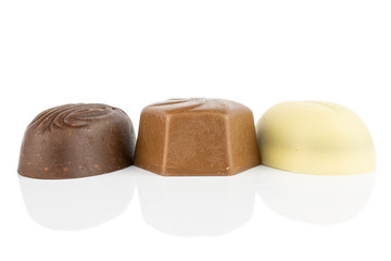 Group of three whole delicious chocolate praline isolated on white background