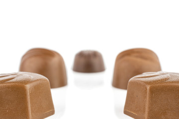 Group of five whole delicious chocolate praline isolated on white background