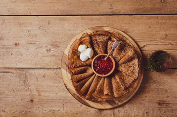 Obraz na płótnie Canvas Russian pancakes with red caviar and sour cream . 