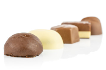 Group of five whole delicious chocolate praline isolated on white background