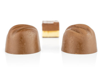 Group of three whole delicious chocolate praline isolated on white background