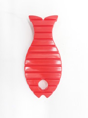 Hand Hold Artistic Red and Yellow Colored Bathroom Toilet Wash Brush with Animal Fish Shape in White Isolated Background