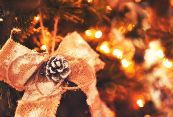 Christmas decorations on the tree in blur. A festive mood at home.