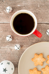 Christmas Biscuits and Coffee Mug on Brown Rustic Wood