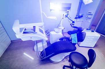 Modern dentistry office interior with chair and tools. Microscope in stomatology.