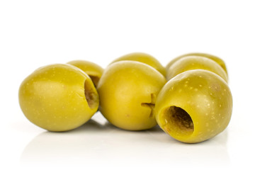 Lot of whole pitted green olive isolated on white background