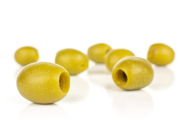 Lot of whole pitted green olive isolated on white background