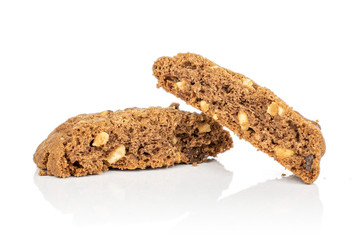 Group of two halves of sweet brown cookie one cracked isolated on white background