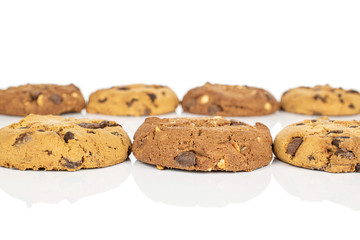 Group of seven whole sweet brown cookie isolated on white background