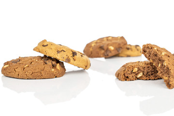 Group of four whole two halves of sweet brown cookie isolated on white background