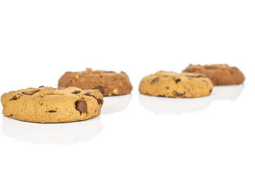 Group of four whole sweet brown cookie front focus isolated on white background