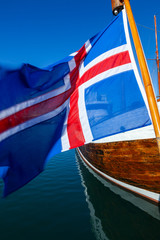 Fototapeta na wymiar Icelandic Flag and Boat, Reykjavik Harbor, Iceland