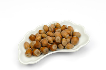 isolated haselnuts on cap