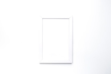 White empty photo frame on white background