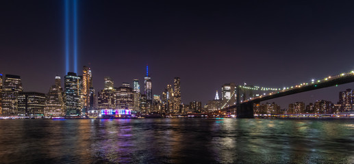 Fototapeta na wymiar Manhattan skyline at night seen from Brooklyn. Tribute in Light