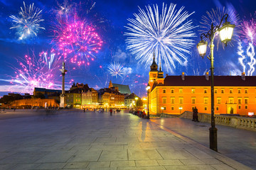 Fireworks display over The Royal Castle  square of Warsaw, Poland