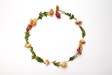 Dried flowers composition. Frame made of dried rose. Flat lay, top view Autumn floral pattern